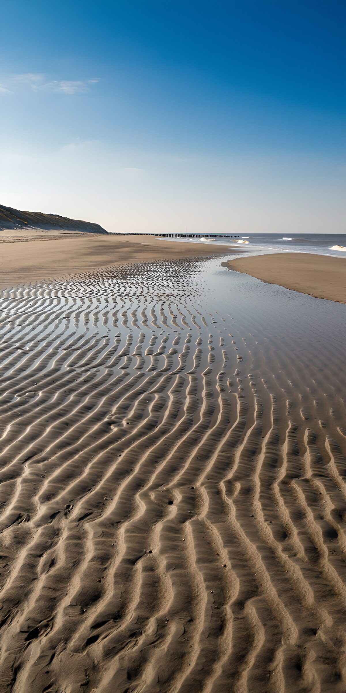 Sandrippel am weiten Strand