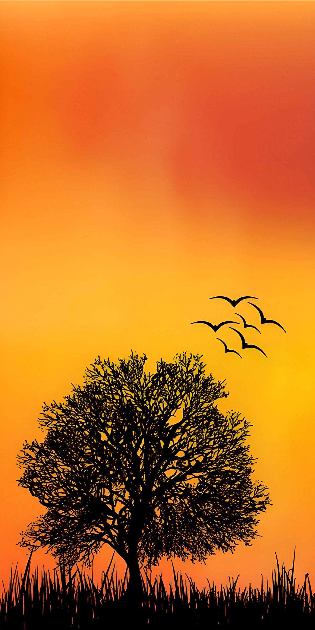 Baum und Vogelschwarm im Abendrot